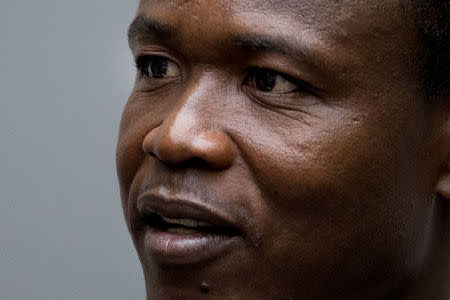 Dominic Ongwen, a senior commander in the Lord's Resistance Army, whose fugitive leader Kony is one of the world's most-wanted war crimes suspects, sits in the court room of the International Court in The Hague, Netherlands, December 6, 2016. REUTERS/Peter Dejong