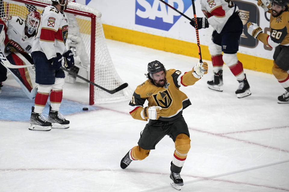 Vegas Golden Knights right wing Mark Stone, center, celebrates after scoring as Florida Panthers goaltender Sergei Bobrovsky, left, sits in goal during the first period in Game 5 of the NHL hockey Stanley Cup Finals Tuesday, June 13, 2023, in Las Vegas. (AP Photo/Abbie Parr)