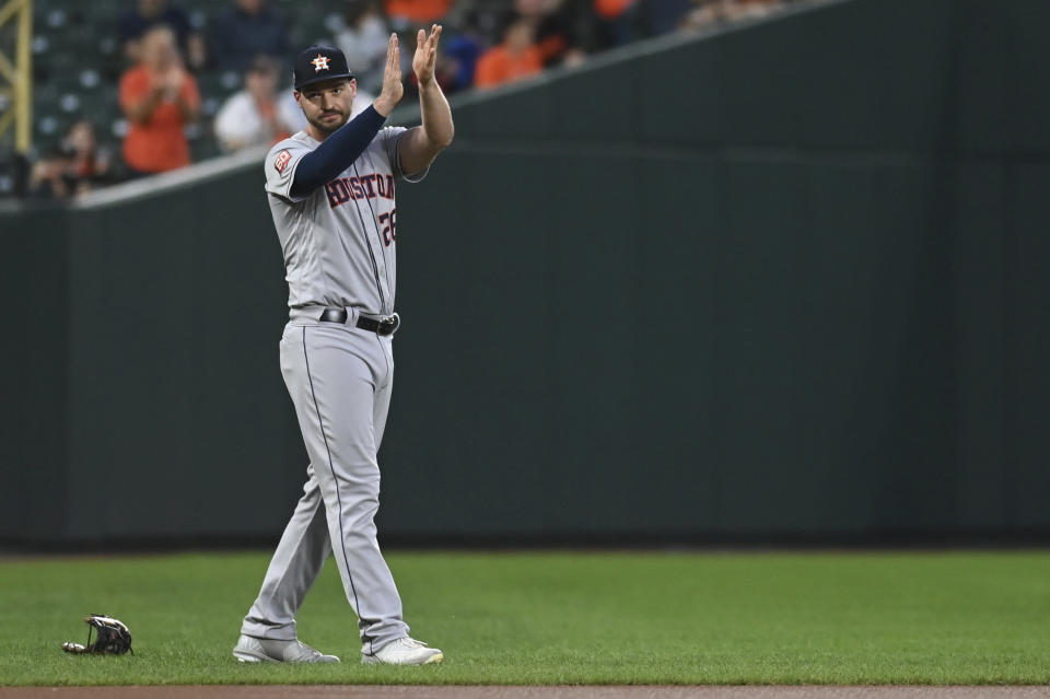 Houston Astros' Trey Mancini (26) reacts after being announced before the team's baseball game against the Baltimore Orioles, Thursday, Sept. 22, 2022, in Baltimore. (AP Photo/Tommy Gilligan)