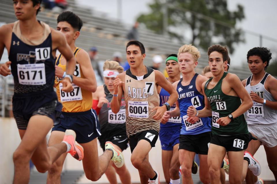Abilene High's Andruw Villa runs in the 3,200 at the Region I-6A track and field meet in Arlington.