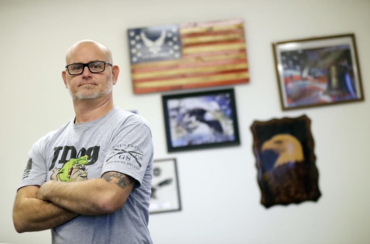 Richard White, operations manager for Appleton-based Jdog Junk Removal, is shown Tuesday in Appleton. White is a U.S. Navy veteran who seeks to have a positive impact on his community, following a mindset he found while serving in the military.