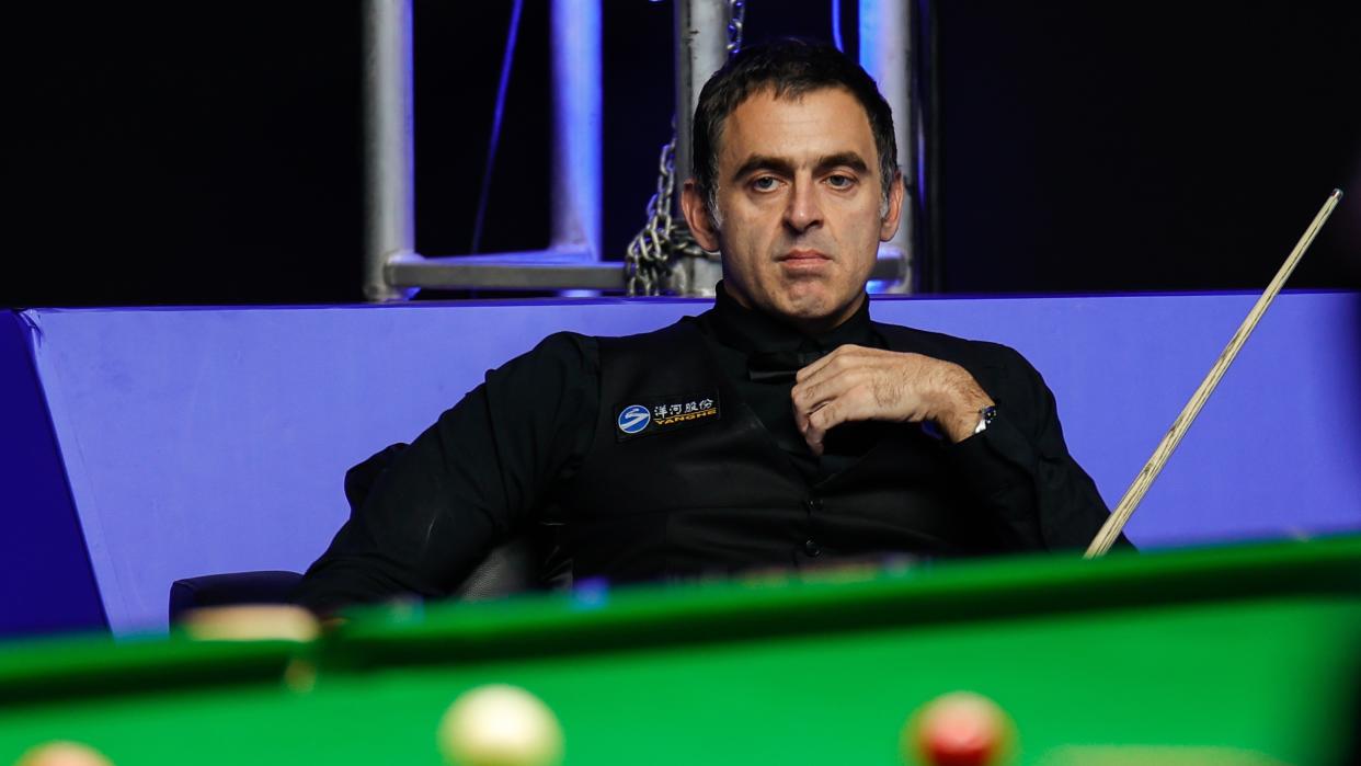  Ronnie O'Sullivan sitting looking at a pool table during the 2023 International Championship (Day 5) . 