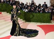 <p>Katy Perry stunned in an embellished Prada gown for the 2016 Met Gala. Paired with a black wig she gave off major Elvira vibes. (Photo: Getty Images) </p>