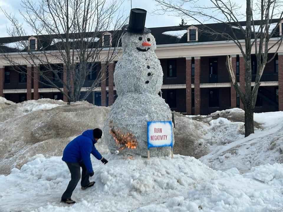 Lake Superior State University President Rodney Hanley lights the snowman on March 20, 2023, officially bringing spring to LSSU.