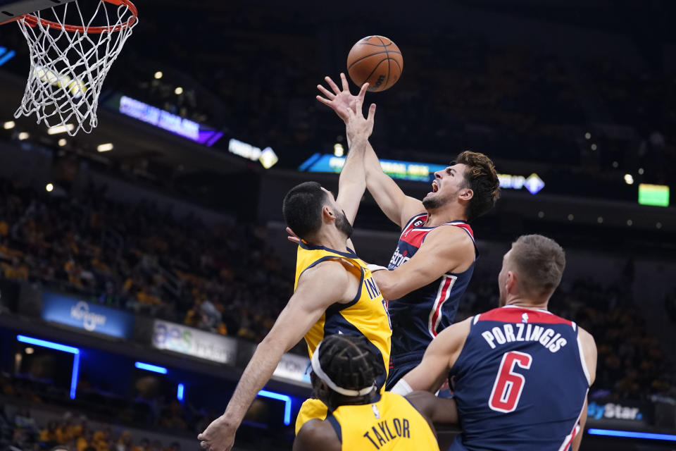 Washington Wizards' Deni Avdija shoots over Indiana Pacers' Goga Bitadze during the first half of an NBA basketball game Wednesday, Oct. 19, 2022, in Indianapolis. (AP Photo/Michael Conroy)