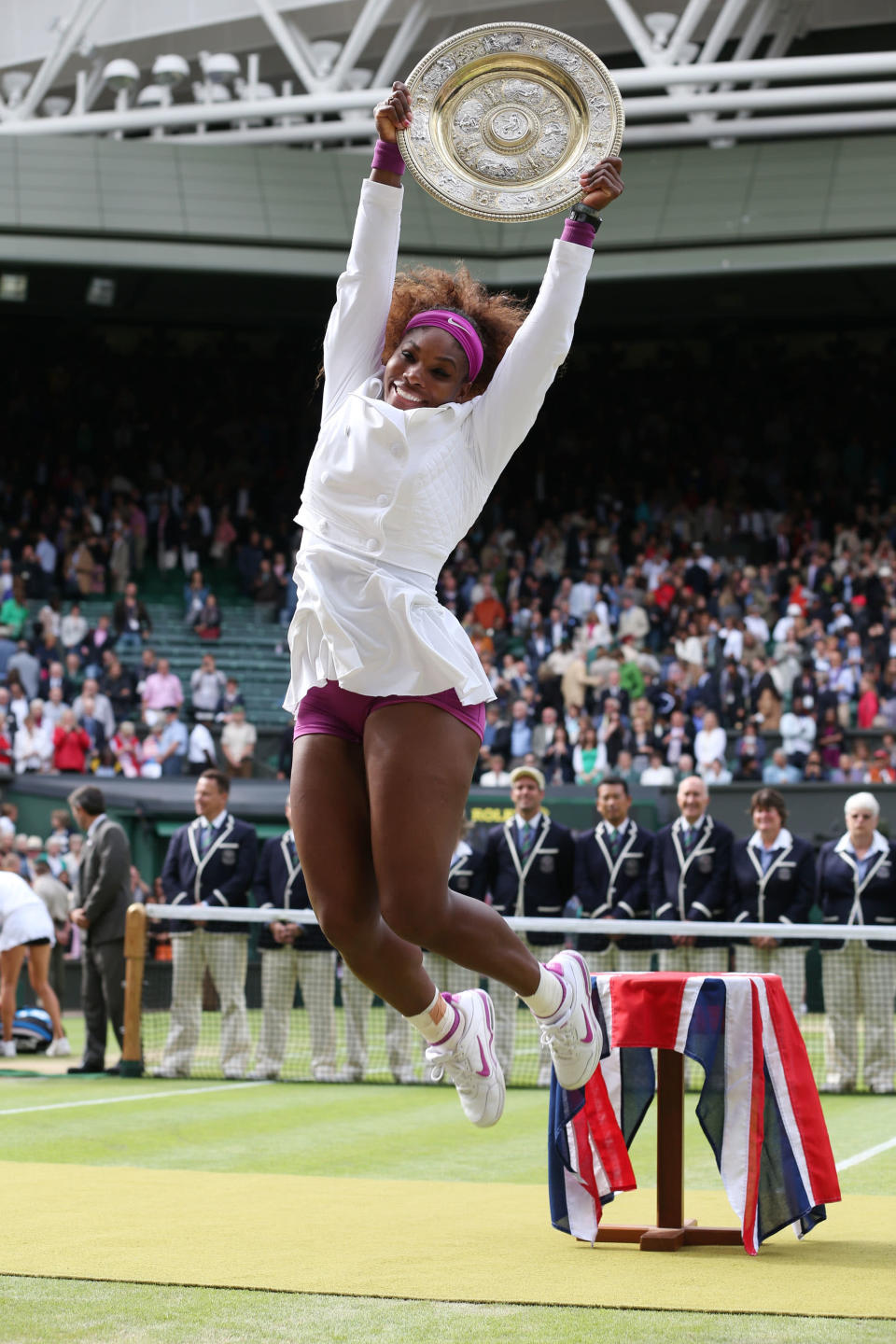 Serena Williams of the USA jumps in the air with the winners trophy and celebrates after her Ladies Singles final match against Agnieszka Radwanska of Poland on day twelve of the Wimbledon Lawn Tennis Championships at the All England Lawn Tennis and Croquet Club on July 7, 2012 in London, England. (Photo by Julian Finney/Getty Images)