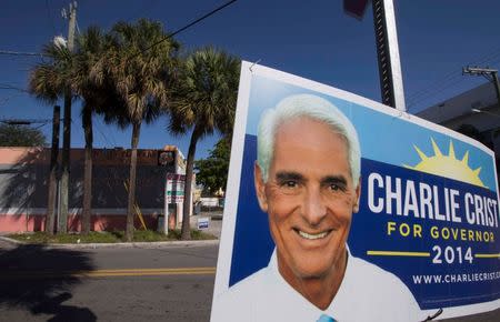 Election signs for former Florida Governor and Democratic gubernatorial candidate Charlie Crist line the street during a four-city bus campaign tour in Miami, Florida November 3, 2014. REUTERS/Scott Audette