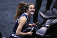 Villanova's Maddy Siegrist smiles as she looks up at a small number of friends and family of the athletes allowed to view the game after an NCAA college basketball game against DePaul in the quarterfinals of the Big East Conference tournament at Mohegan Sun Arena, Saturday, March 6, 2021, in Uncasville, Conn. (AP Photo/Jessica Hill)