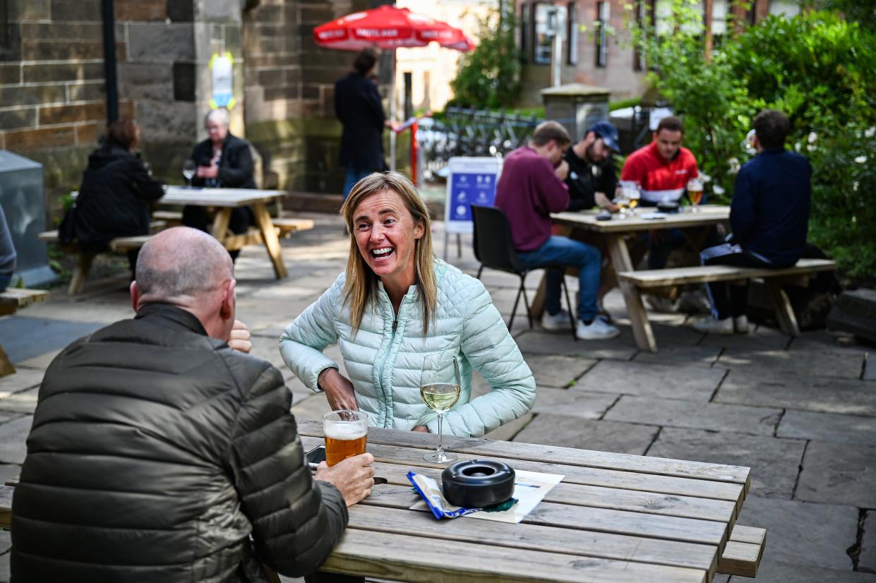 Members of the public enjoy their first drink in a beer garden at the Cottiers in the West End on July 6, 2020, in Glasgow, Scotland. Beer gardens across Scotland are permitted to reopen today, as the coronavirus lockdown restrictions are eased further in the country.