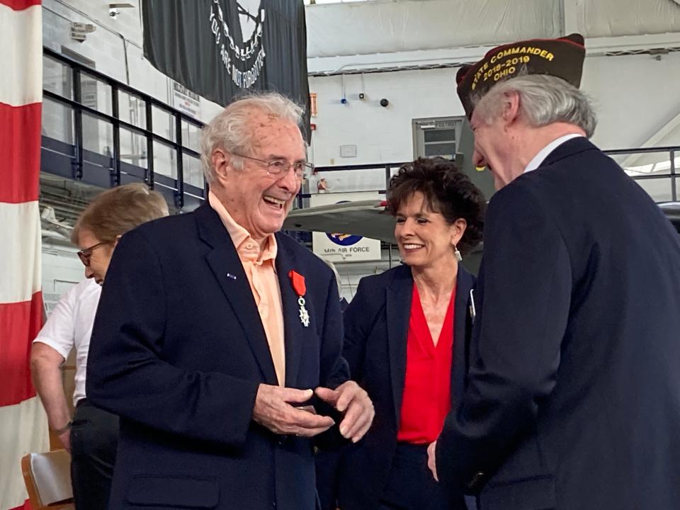 Walter B. Stitt, left, speaks with David K. Root, past president of the Ohio Department of the Veterans of Foreign Wars. Stitt received the French Legion of Honor on Saturday in recognition of his service in France during World War II.