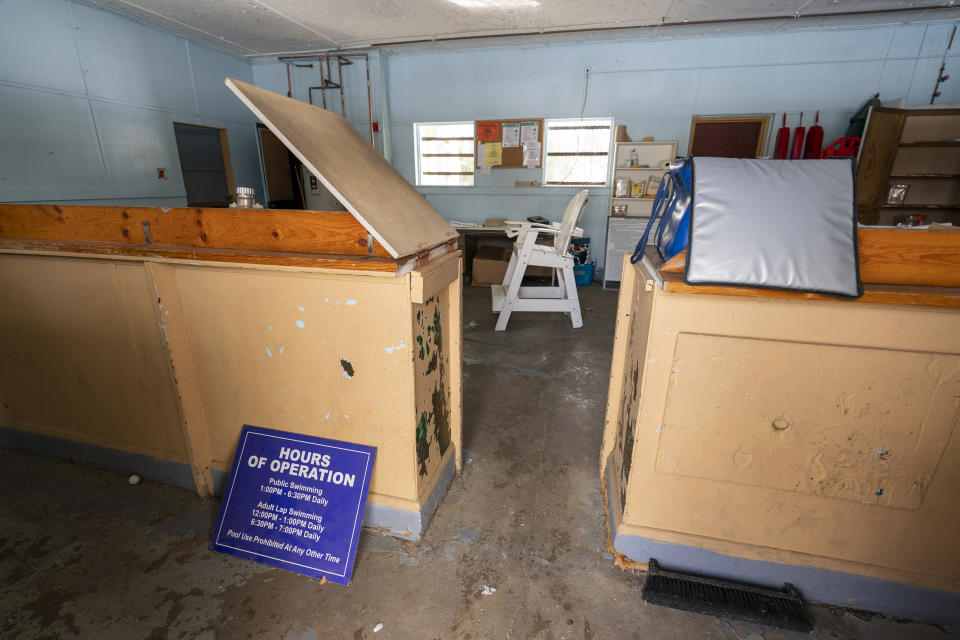 The reception area at the Spratt Park pool house in Poughkeepsie, N.Y., is in need of repair, on Tuesday, Jan. 25, 2022. Poughkeepsie was rated by the New York comptroller as the state’s most financially stressed community in 2020. The more than $20 million it is getting from the American Rescue Plan cannot be used to wipe out the deficit, but the city plans to make major improvements to parks and swimming pools, including a complete rebuild of a run-down bathhouse that has been relying on portable toilets. (AP Photo/Mary Altaffer)