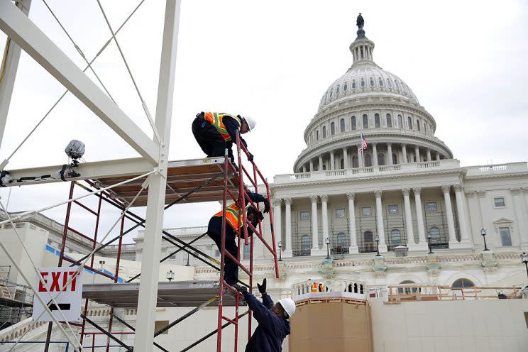 Employees of the Architect of the Capitol build a scaffolding as construction of the 2017 presidential inaugural platform continues. (Alex Wong/Getty Images)