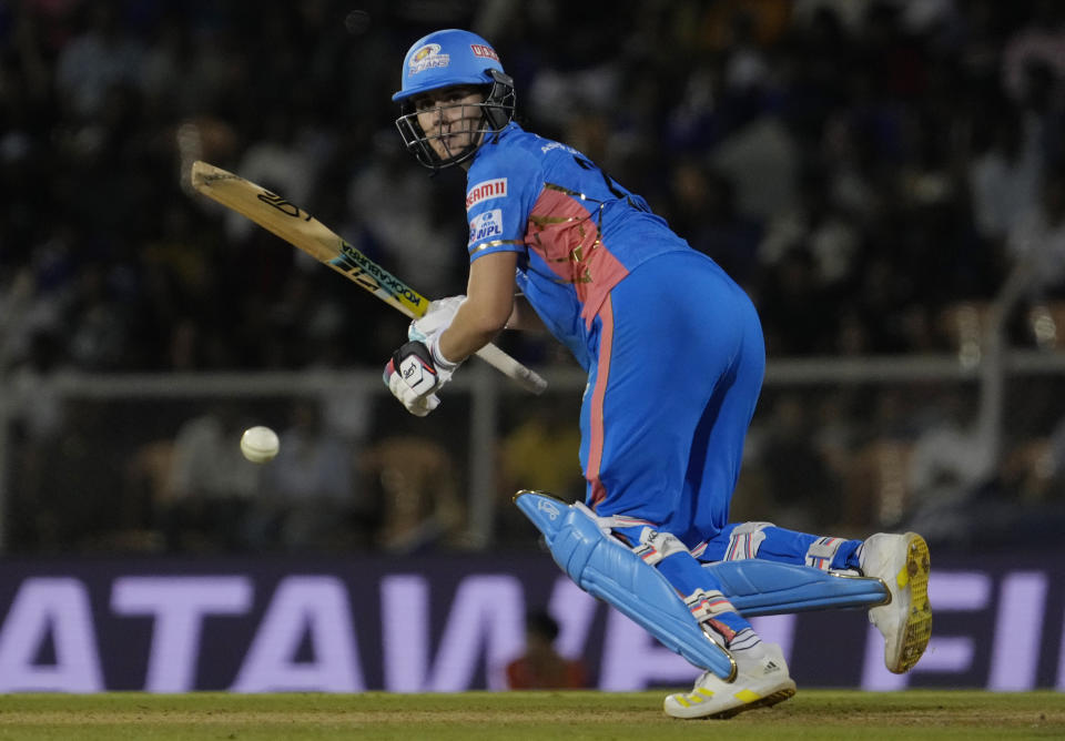 Mumbai Indians Nat Sciver-Brunt plays a shot during during the Women's Premier League Twenty20 cricket final match between Delhi Captials and Mumbai Indians in Mumbai, India, Sunday, March 26, 2023. (AP Photo/Rajanish Kakade)