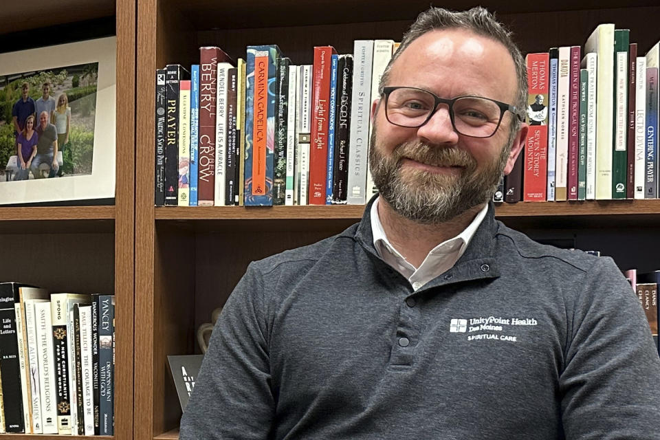 Eric Johnson, director of spiritual care at UnityPoint Health's Des Moines, Iowa-area hospitals, sits for a portrait on March 11, 2024. He has served as a chaplain in hospitals for 15 years. Chaplains, traditionally a clergyperson ministering outside of a congregation, have long served in the U.S., but some conservatives are hoping to introduce the role in public schools. (AP Photo/Hannah Fingerhut)