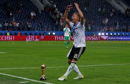 Soccer Football - Chile v Germany - FIFA Confederations Cup Russia 2017 - Final - Saint Petersburg Stadium, St. Petersburg, Russia - July 2, 2017 Germany’s Joshua Kimmich celebrates with the trophy after winning the FIFA Confederations Cup REUTERS/Grigory Dukor