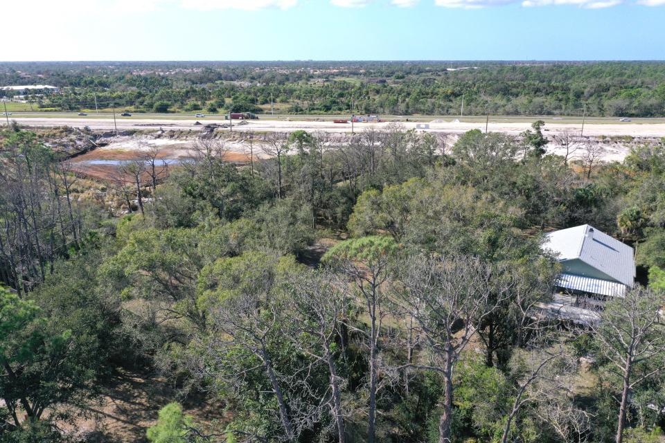 This aerial image shows a five-acre site purchased from the Rebecca Lee Morgan Revocable Living Trust. The home site is south of East Venice Avenue and adjacent to a borrow pit that the Florida Department of Transportation owns and contractors are using for the widening of River Road.