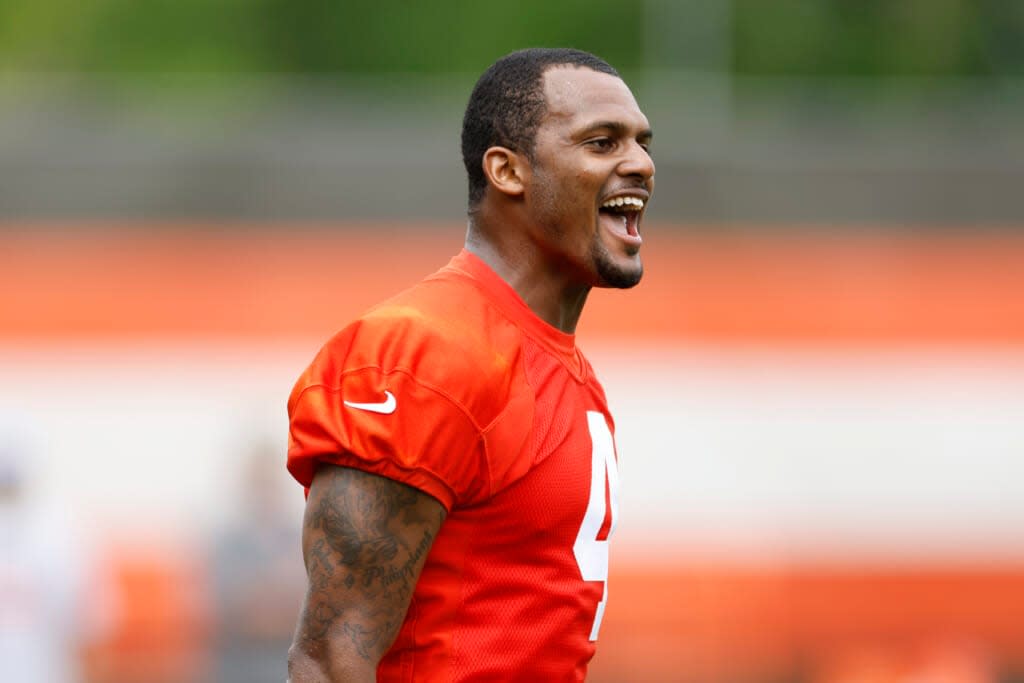 Cleveland Browns quarterback Deshaun Watson celebrates after a play during an NFL football practice at the team’s training facility Wednesday, May 25, 2022, in Berea, Ohio. (AP Photo/Ron Schwane)