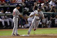 ARLINGTON, TX - OCTOBER 22: Albert Pujols #5 of the St. Louis Cardinals is congratulated by first base coach Dave McKay as he rounds the bases after hitting a three-run home run in the sixth inning during Game Three of the MLB World Series against the Texas Rangers at Rangers Ballpark in Arlington on October 22, 2011 in Arlington, Texas. (Photo by Rob Carr/Getty Images) Dave McKay