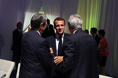 French President Emmanuel Macron (C) speaks with Cypriot President Nicos Anastasiades (L) and Italy's Prime Minister Paolo Gentiloni before an informal dinner ahead of a summit with leaders of the six Western Balkans countries in Sofia, Bulgaria, May 16, 2018. REUTERS/Stoyan Nenov/Pool