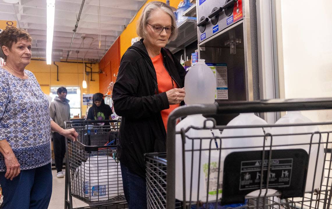 Anne Brundige of Pittsboro, left , and Sharon Brown of Siler City, fill water bottles at Chatham Marketplace in Pittsboro on Tuesday, May 7, 2024.