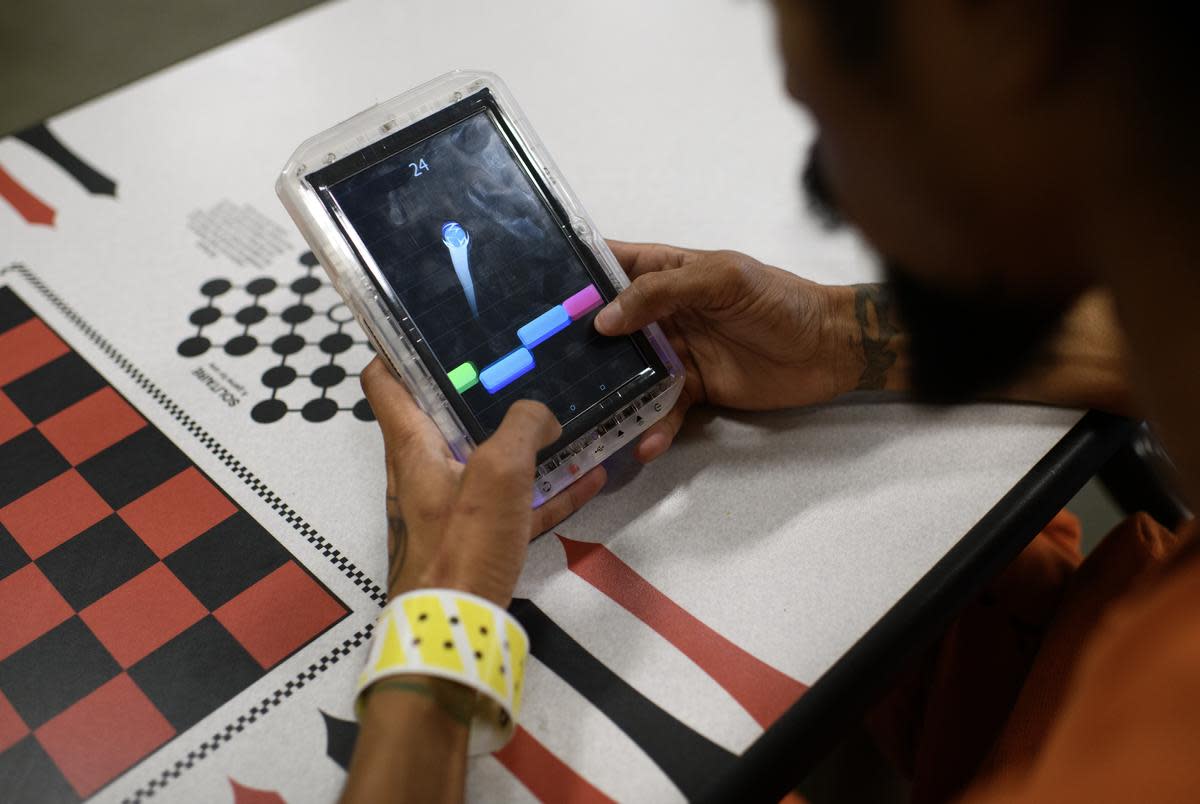A man plays a game in the Brothers in Arms cell block, a new veteran-focused program, at the Harris County Joint Processing Center on Tuesday, April 16, 2024, in Houston.