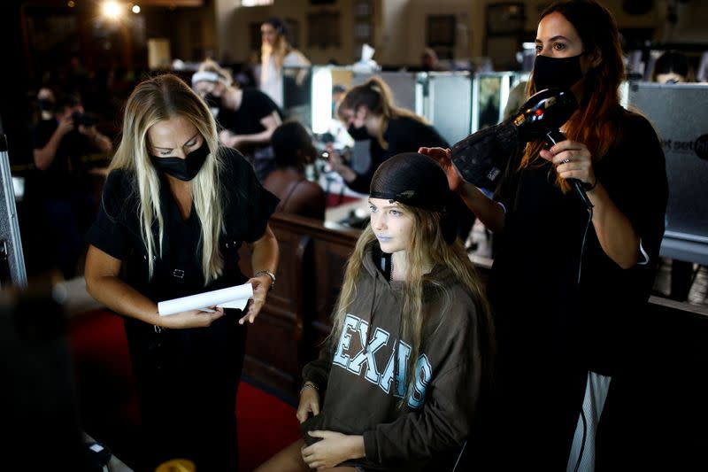 Models prepare backstage of the Bora Aksu catwalk show at London Fashion Week 2020, in London