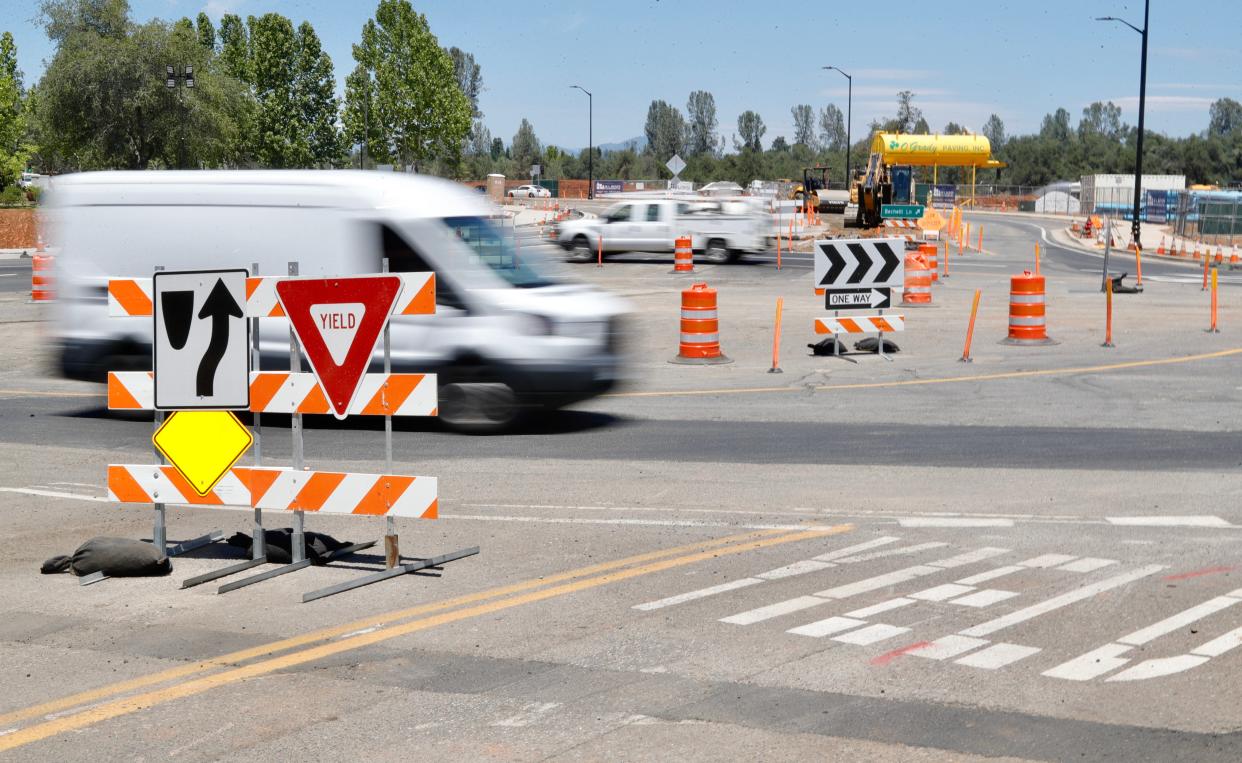 Drivers use the new, temporary one-lane roundabout at the intersection of South Bonnyview Road and Bechelli Lane in Redding on Wednesday, June 15, 2022.