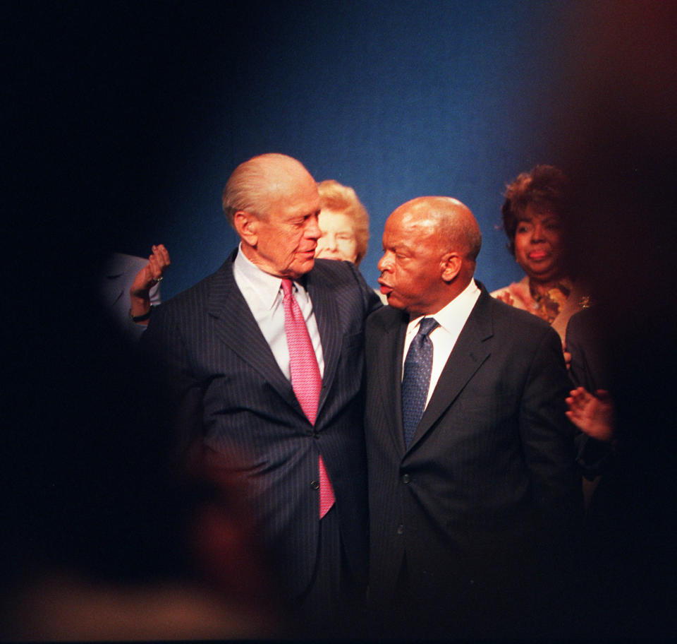 President Gerald Ford, left, and Congressman John Lewis, right, embrace after receiving Profiles in Courage awards at the JFK Library on May 21, 2001. Congressman John Lewis was cited for lifetime achievement. (Photo: Joanne Rathe/The Boston Globe via Getty Images)