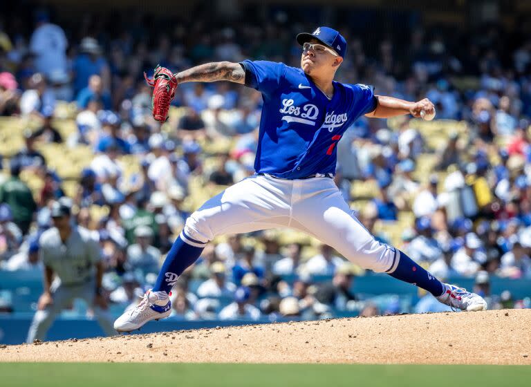 LOS ANGELES, CA - AUGUST 13, 2023: Los Angeles Dodgers starting pitcher Julio Urias (7) pitches.