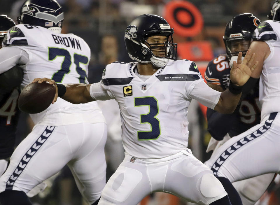 Seattle Seahawks quarterback Russell Wilson (3) throws a pass during the first half of an NFL football game against the Chicago Bears Monday, Sept. 17, 2018, in Chicago. (AP Photo/Nam Y. Huh)