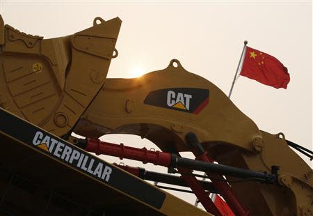 A Caterpillar excavator is displayed at the China Coal and Mining Expo 2013 in Beijing October 22, 2013. REUTERS/Kim Kyung-Hoon