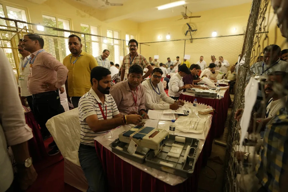 Election officers count votes for the recent election at a counting center in Jammu, India, Tuesday, Oct. 8, 2024. (AP Photo/Channi Anand)