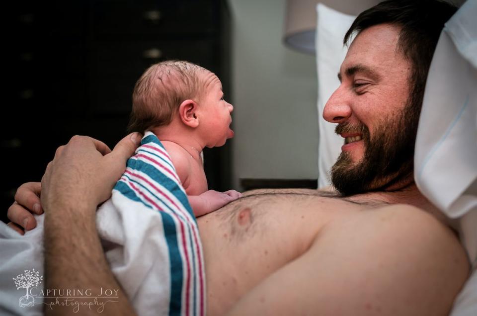 "This baby's mom had just handed her to her father for some skin-to-skin ... and this sweet girl was clearly absolutely smitten! At less than&nbsp;two&nbsp;hours old, she was raising her head to look straight into his eyes."