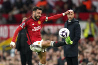Manchester United's Bruno Fernandes kicks the ball during the English Premier League soccer match between Manchester United and Newcastle United, in Manchester, England, Wednesday, May 15, 2024. (AP Photo/Dave Thompson)