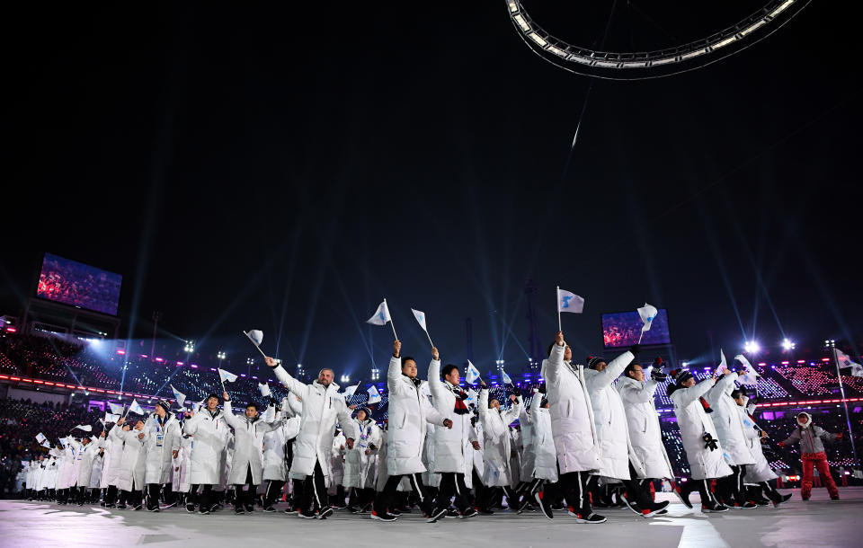 The North Korea and South Korea Olympic teams enter together under the Korean Unification Flag. A historic moment.