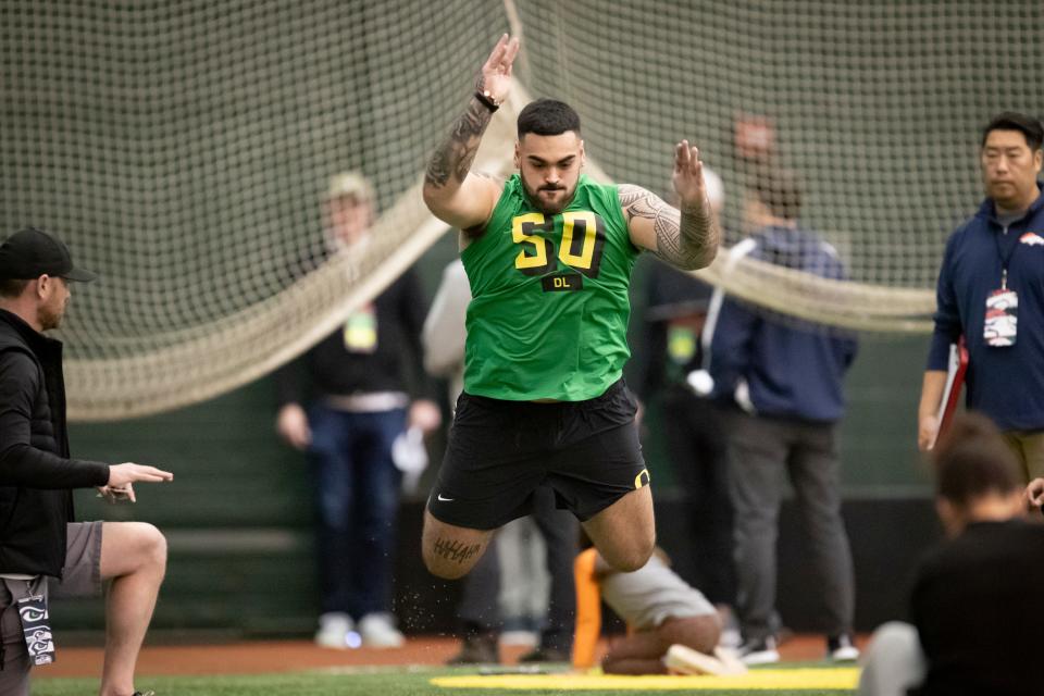 Oregon defensive tackle Popo Aumavae participates in the broad jump during Oregon Pro Day Tuesday, March 12, 2024 at the Moshofsky Center in Eugene, Ore.