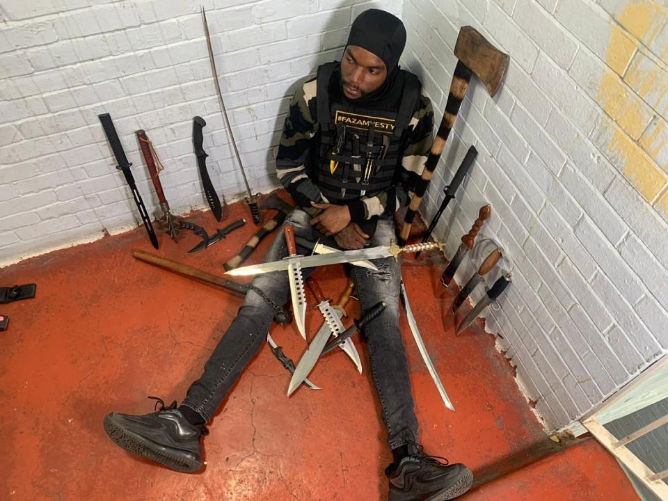 Faron Paul with just some of the weapons he has taken off the streets (Supplied)