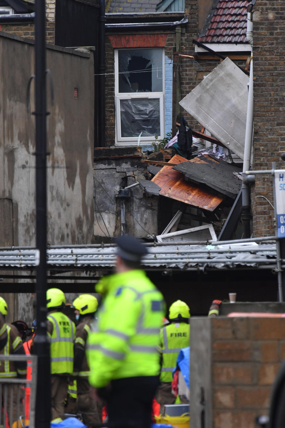 Emergency services at the scene of a suspected gas explosion on King Street in Ealing, west London. Rescuers are involved in a "complex" search for anyone who may still be inside the collapsed building.