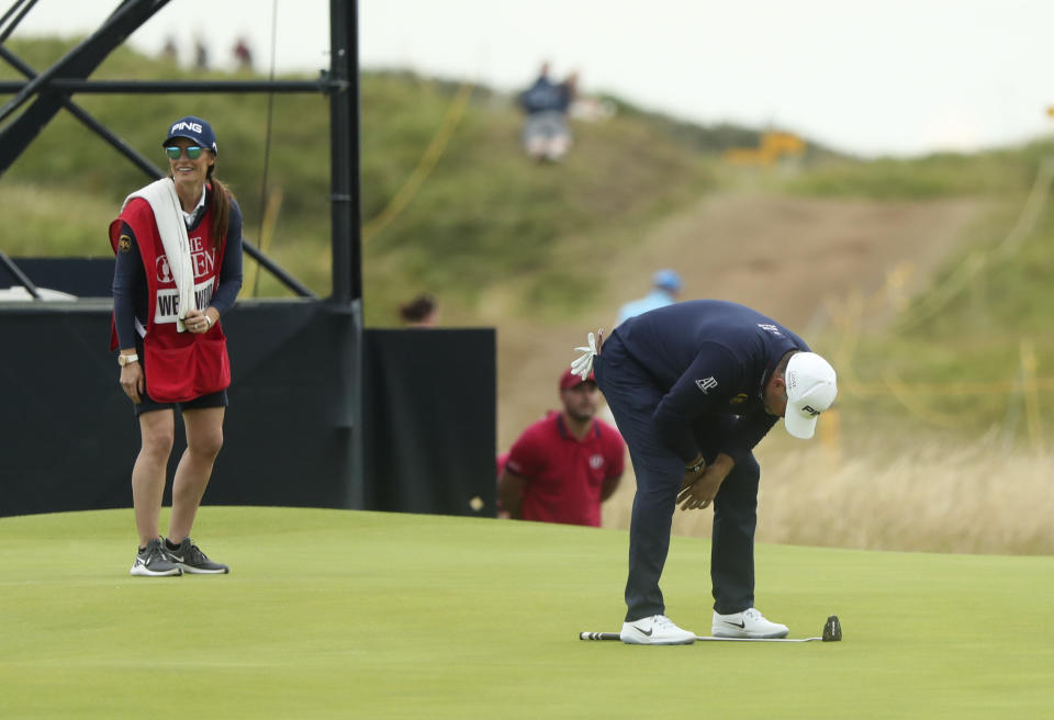 England's Lee Westwood looks down at his club after missing a shot on 14th green during the third round of the British Open Golf Championships at Royal Portrush in Northern Ireland, Saturday, July 20, 2019.(AP Photo/Jon Super)