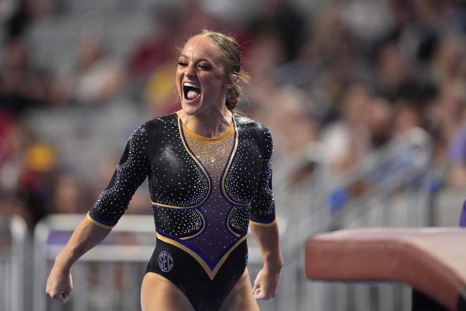 LSU's Savannah Schoenherr celebrates after competing on the vault during the NCAA women's gymnastics championships in Fort Worth, Texas, Thursday, April 18, 2024. (AP Photo/Tony Gutierrez)