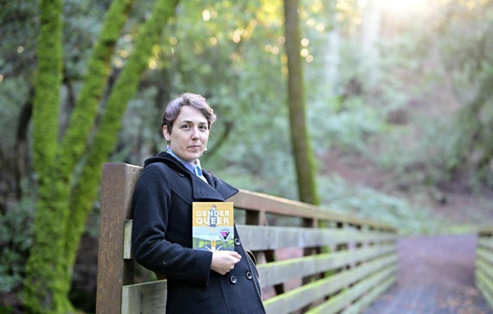 Maia Kobabe stands with "Gender Queer: A Memoir" at North Sonoma Regional Park in Santa Rosa.