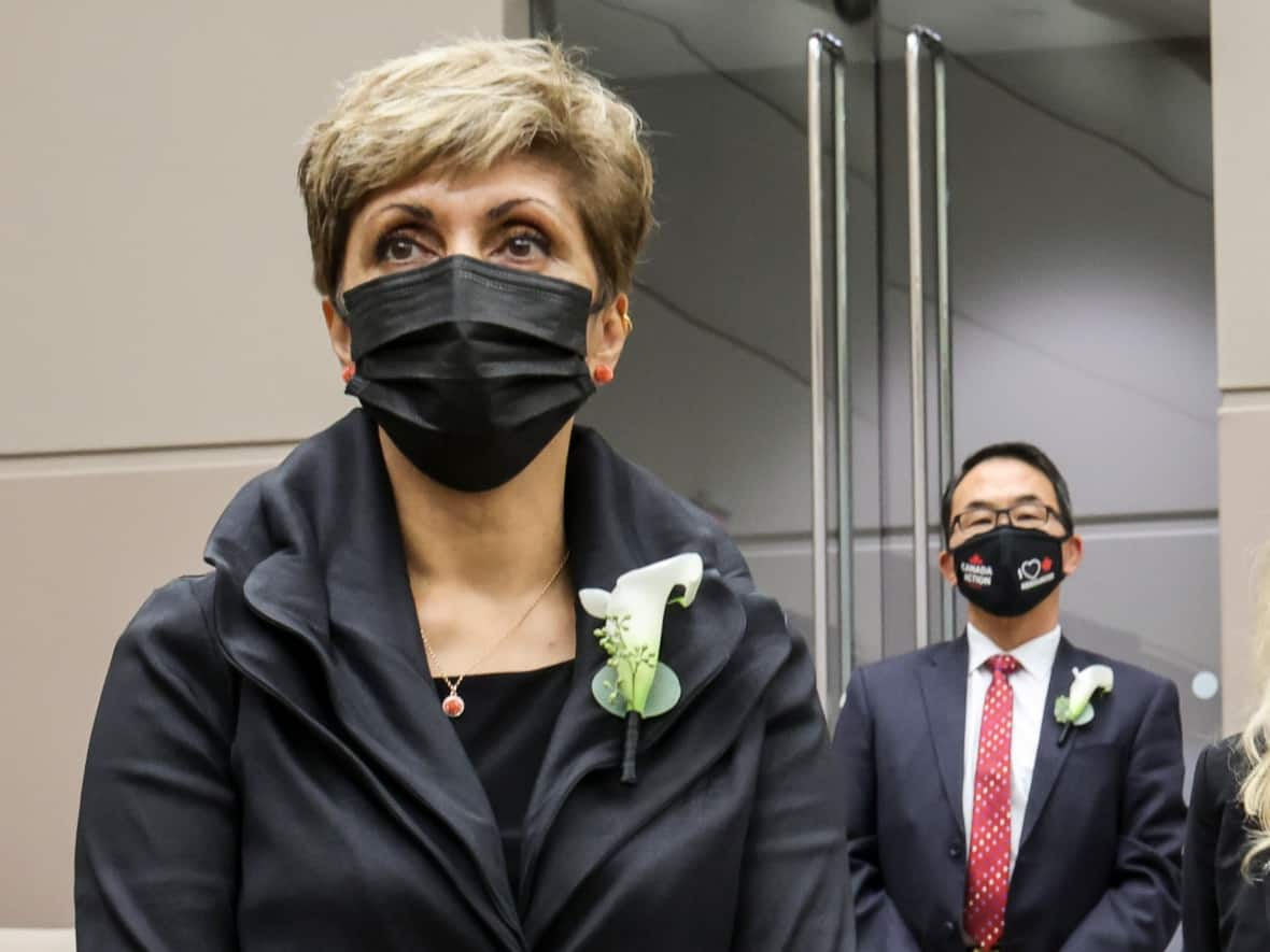 Mayor Jyoti Gondek, left, and Coun. Sean Chu stand during a swearing-in ceremony in Calgary on Oct. 25, 2021. (Gavin Young/The Canadian Press - image credit)