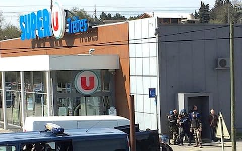  police gather outside a supermarket in Trebes - Credit: AP