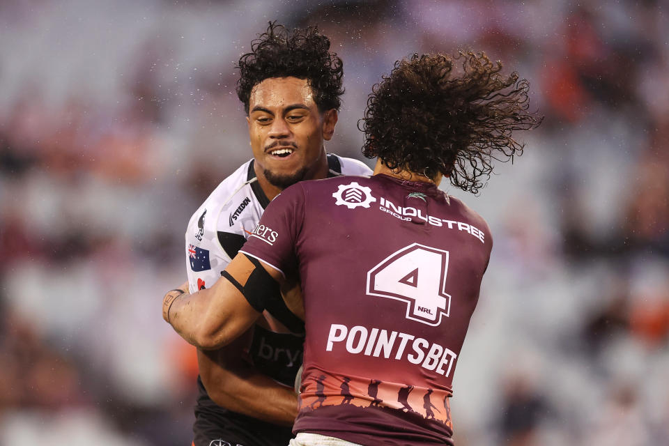 Seen here, Jahream Bula is tackled on his NRL debut for the Wests Tigers against Manly. 