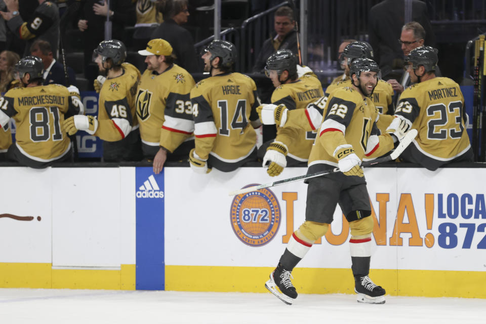 Vegas Golden Knights right wing Michael Amadio (22) is congratulated for his goal against the Chicago Blackhawks during the third period of an NHL hockey game Tuesday, April 16, 2024, in Las Vegas. (AP Photo/Ian Maule)