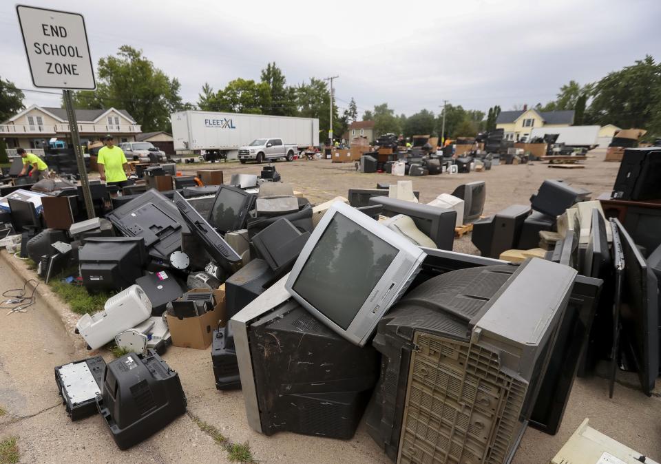 Old electronic devices are seen piled up Aug. 21 in the parking lot of Immanuel Lutheran Church in Wisconsin Rapids. The devices were collected Aug. 19 from local residents as part of an electronics recycling event operated as a fundraiser by Love INC.