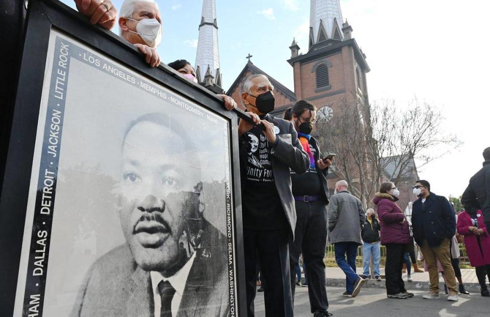 An estimated 300 people gather at St. John’s Cathedral for the start of the annual MLK march to the Fresno Memorial Auditorium Monday morning, Jan. 17, 2022 in downtown Fresno.