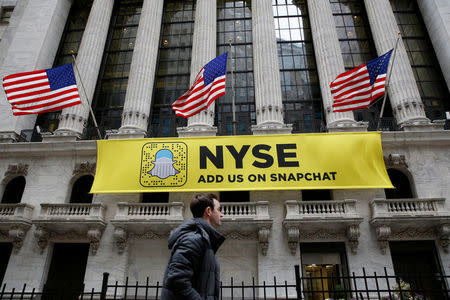 A Snapchat sign hangs on the facade of the New York Stock Exchange (NYSE) in New York City, U.S., January 23, 2017. REUTERS/Brendan McDermid/File Photo