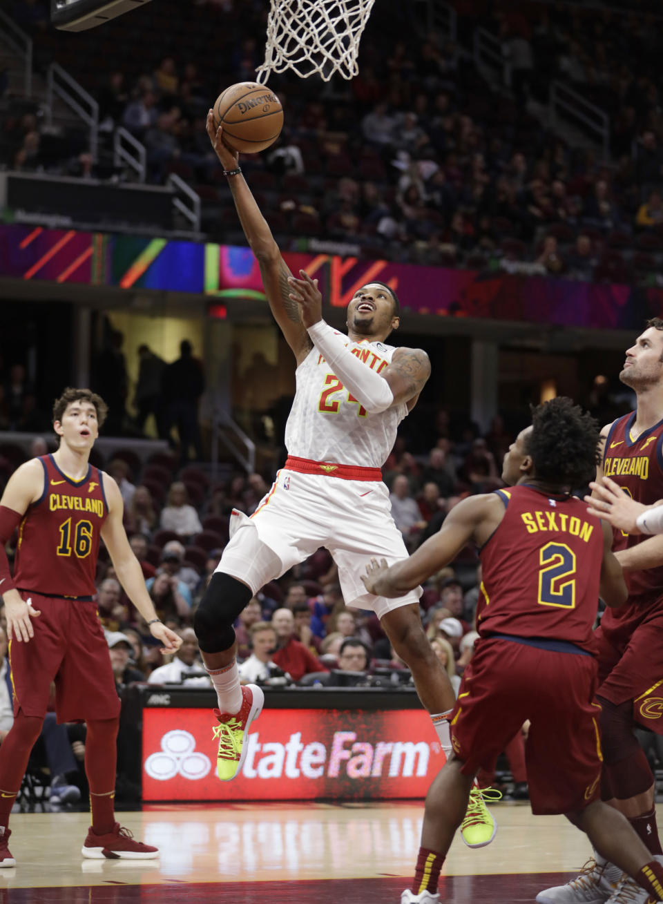 Atlanta Hawks' Kent Bazemore (24) drives to the basket against the Cleveland Cavaliers in the second half of an NBA basketball game, Sunday, Oct. 21, 2018, in Cleveland. (AP Photo/Tony Dejak)