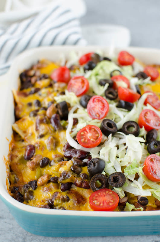 <p>Fake Ginger</p><p>Black beans, pinto beans, and kidney beans layered with corn tortillas, enchilada sauce and cheese. An easy meatless meal the whole family will love!</p><p><strong>Get the recipe: <a href="https://fakeginger.com/three-bean-enchilada-casserole/" rel="nofollow noopener" target="_blank" data-ylk="slk:Three Bean Enchilada Casserole;elm:context_link;itc:0;sec:content-canvas" class="link rapid-noclick-resp">Three Bean Enchilada Casserole</a></strong></p>
